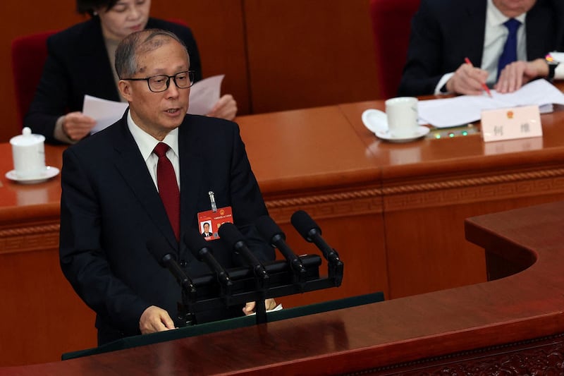 2024年3月5日,中国第十四届全国人大第二次全体会议在北京人民大会堂开幕,人大常委会副委员长李鸿忠作关于国务院组织法修订草案的说明。(路透社)