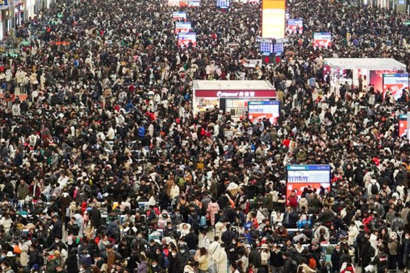 Travelers wait for their trains at Shanghai Hongqiao railway station in Shanghai, China, Feb. 7, 2024. (Nicoco Chan/Reuters)