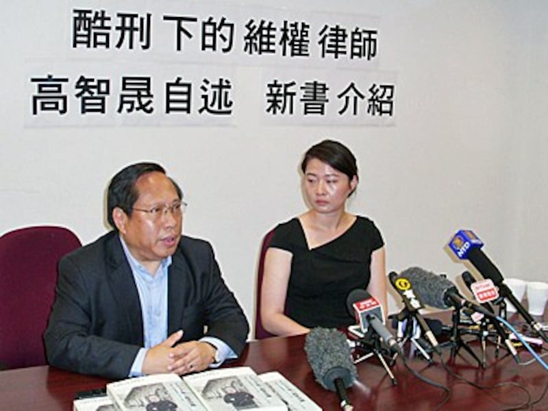 Albert Ho (L), chairman of the China Human Rights Lawyer Concern Group, and Grace Geng (R), daughter of dissident lawyer Gao Zhisheng, address the media at the book launch in Hong Kong, June 14, 2016.