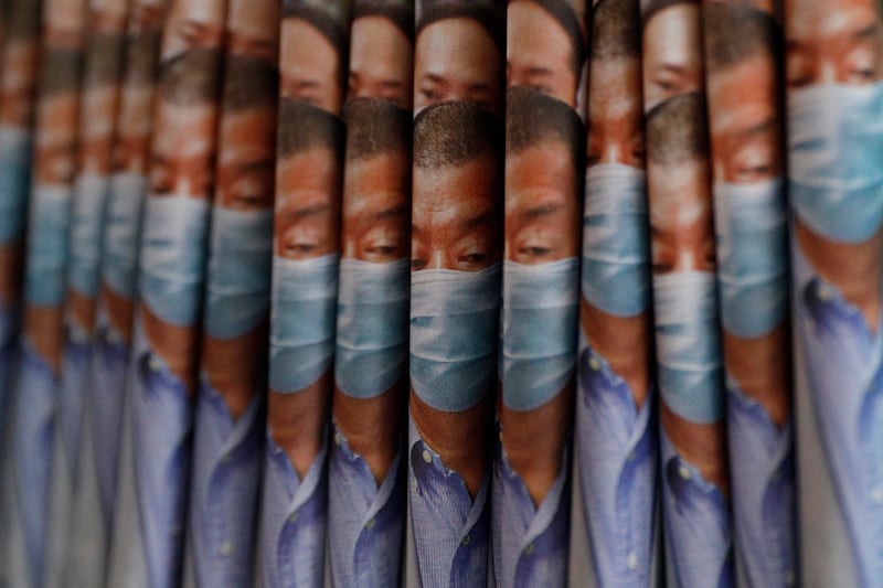 Copies of the Apple Daily newspaper, with front pages featuring Hong Kong media tycoon Jimmy Lai, are displayed for sale at a newsstand in Hong Kong, Aug. 11, 2020.