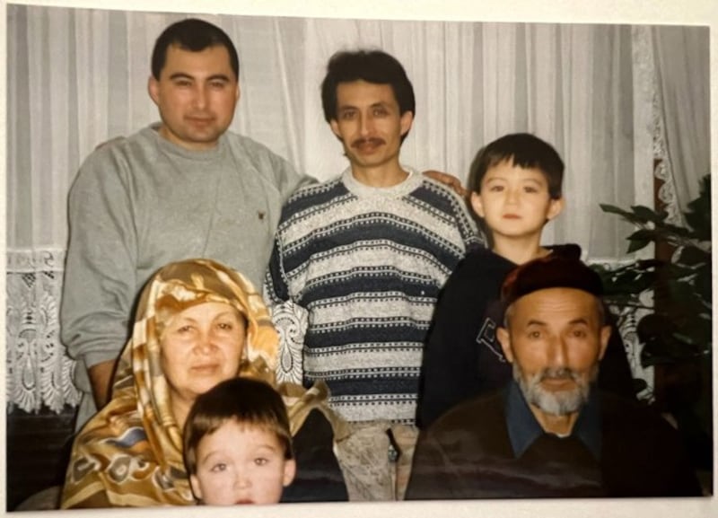 Abdulkerim Zikrullah Idris (bottom, R) is seen with his wife, Habibehan Idris, son Abdulhakim Idris (top, L), Abdulhakim's two children and a friend in Munich, Germany, in 2001. Credit: Courtesy photo